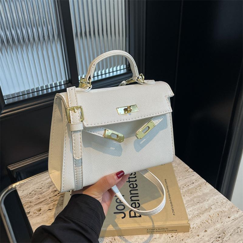New fashionable solid color cross pattern portable shoulder oblique span trendy women's bag