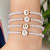 A Simple and Versatile 26-letter Pearl Bracelet, a Fashionable Elastic Beaded Bracelet for Women, a Wrist Accessory.