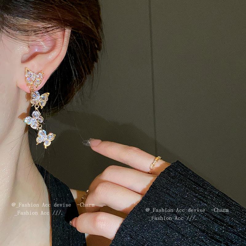 Silver needle zircon butterfly fringed earrings, niche creative design earrings, fashionable light luxury ins style earrings