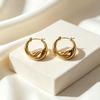 Curved Gold Stainless Steel Earrings - Simple, Luxurious Design with Bright Surface for Versatile Style.