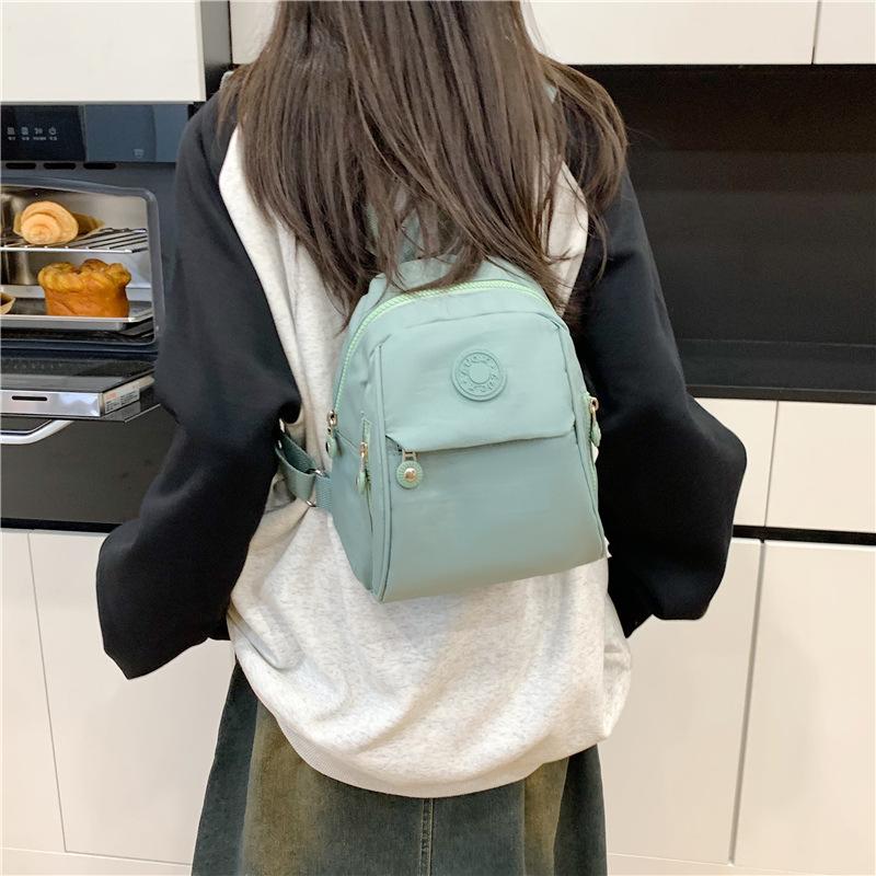 

Мини маленькая сумка рюкзак из ткани Оксфорд женский новый водонепроницаемый универсальный однотонный легкий рюкзак зелёный