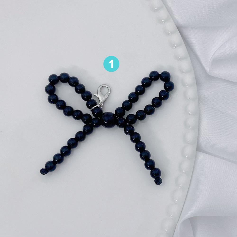 The same Xiaohongshu INS new small pearl bow fashion anti-lost pendant mini short mobile phone chain