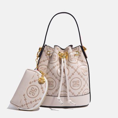 Spring and Summer New Embossed Bucket Bag Drawstring Niche Min Handbag Vertical Casual Shoulder Messenger Bag Versatile
