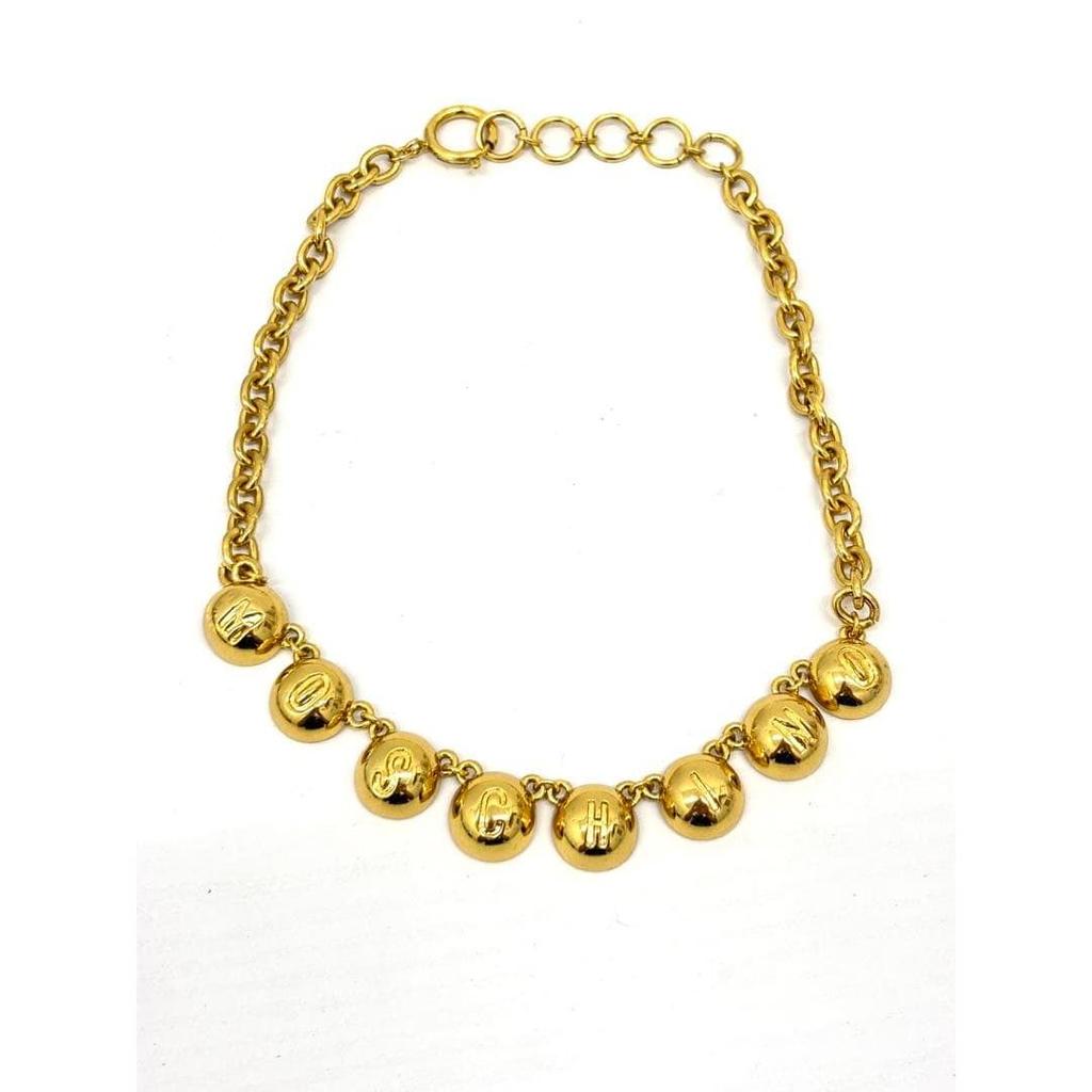 Used Moschino gold color necklace with logo charm vintage