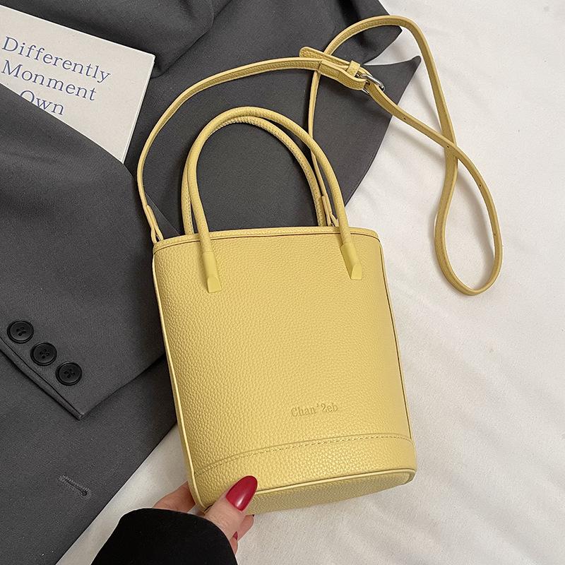 This year's popular niche simple dopamine lychee pattern portable bucket bag women's versatile casual messenger mobile phone bag