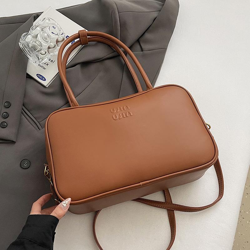 

2025 новый ретро нишевый простой стиль портативная сумка-подушка модная с высоким чувством, для通勤, универсальная сумка-мессенджер женская