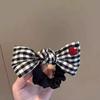 Age-Reducing Black & White Plaid Bow Hair Tie