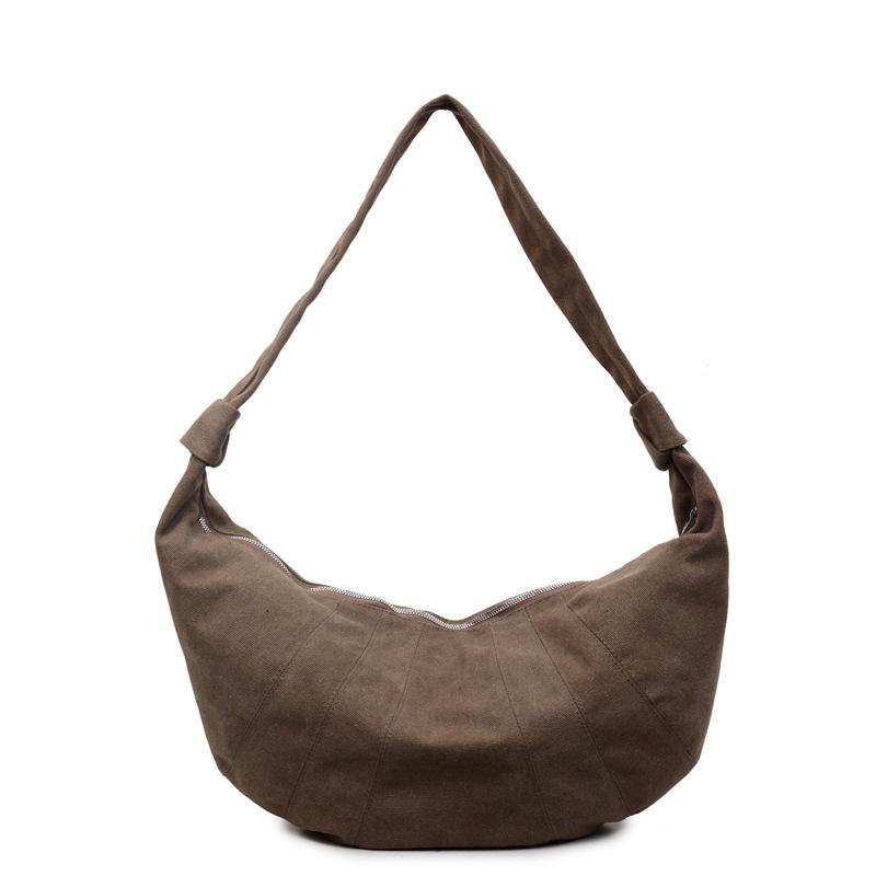 

Large-capacity casual dumpling bag women s 2025 autumn new fashionable foreign canvas bag commuter shoulder bag