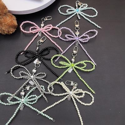 Modīga korejiešu stila blogera iedvesmota liela pērļu bante, mobilā telefona piekariņš, atslēgu piekariņš ar sirds dizainu.