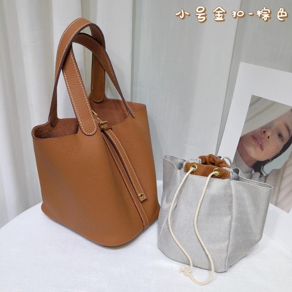 Spot wholesale top layer cowhide vegetable basket bag leather bucket bag commuter fashion lock buckle hand-held handbag woman