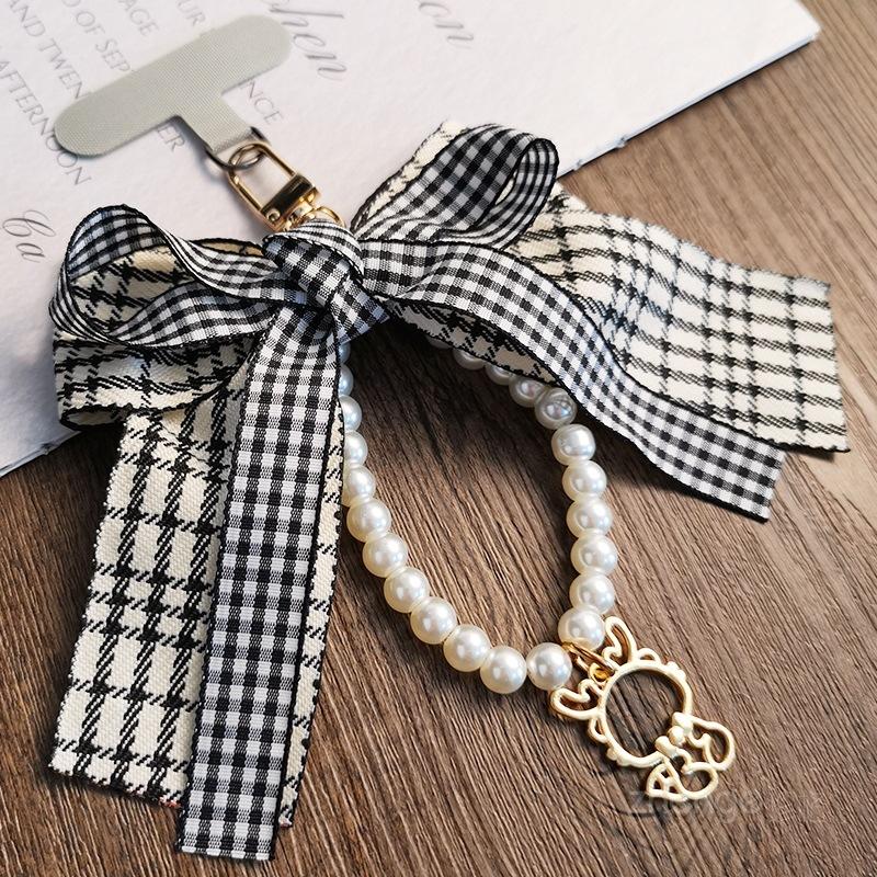 

Qiandongge Bow Hollow Dragon Pendant Pearl Bracelet Women s Xiaoxiangfeng Mobile Phone Lanyard Short Wrist Lanyard hollow dragon pendant pearl bracelet