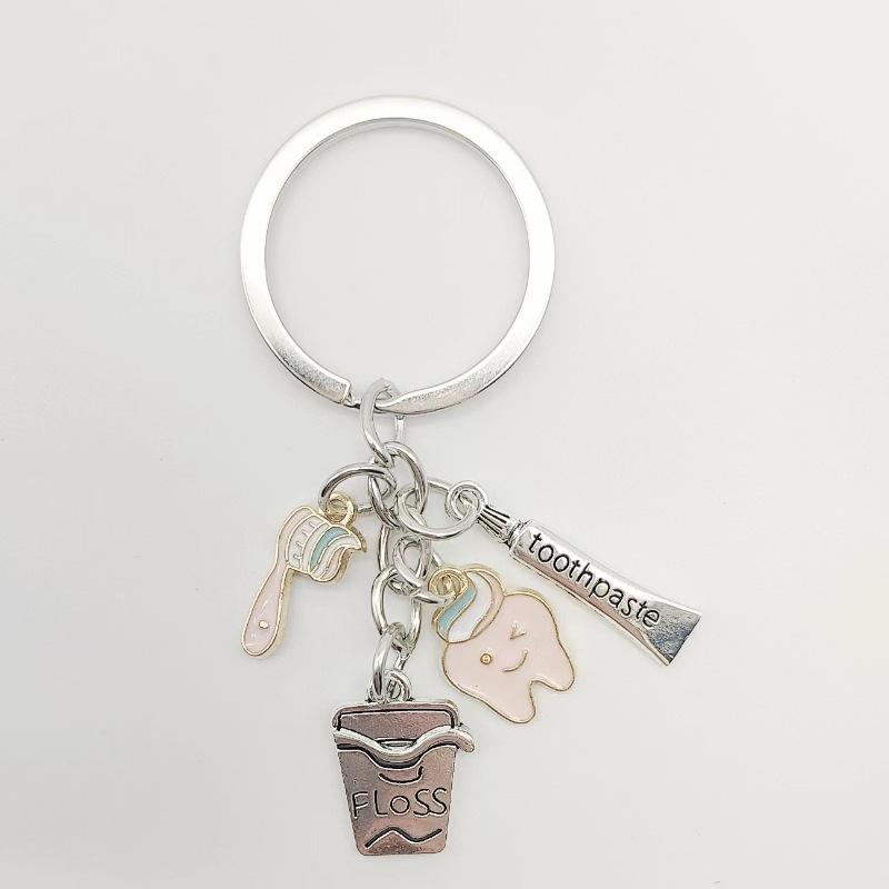 European and American Style Dental Care Keychain with Toothbrush, Toothpaste, and Floss - Creative Backpack Pendant Gift