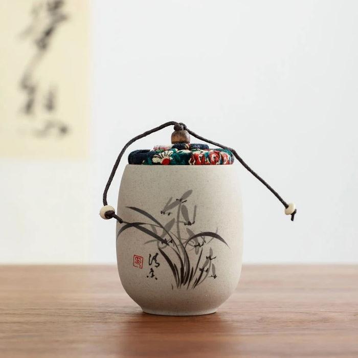 Portable Sealed Ceramic Tea Jar – Pottery Storage Canister with Plum, Orchid, Bamboo & Chrysanthemum Design