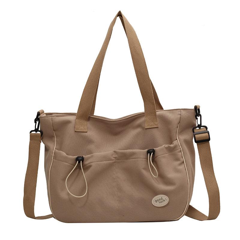 

Женская наплечная сумка-мессенджер 2025 новая большая вместительная студенческая сумка для занятий модная и простая однотонная холщовая сумка хаки