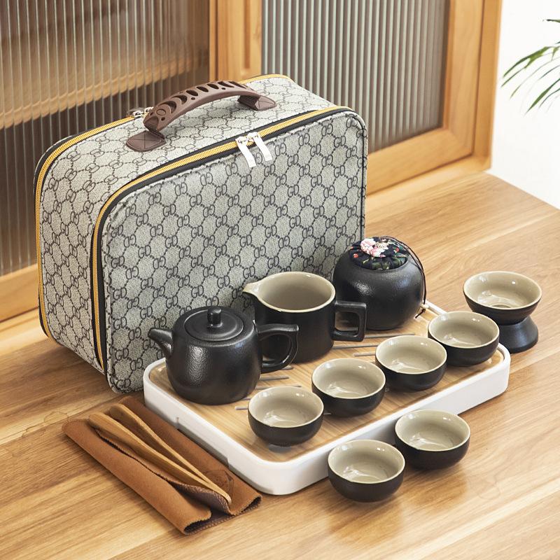 Black pottery travel kung fu tea set portable business gift set creative ceramic cooling pot set