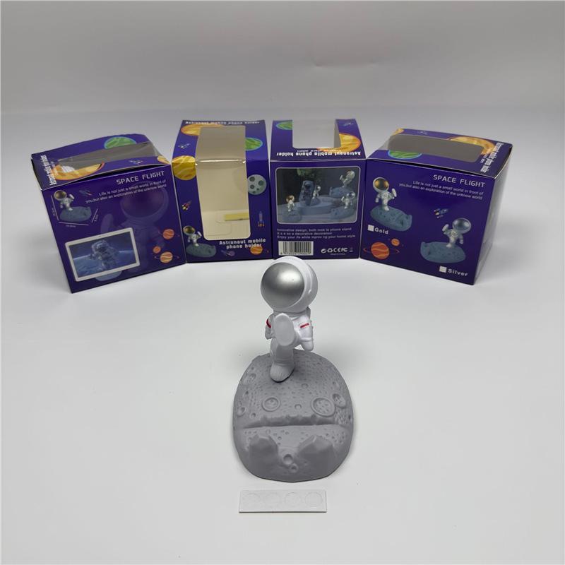 Astronaut Figurine Phone Holder: Creative Plastic Desktop Decor & Gift