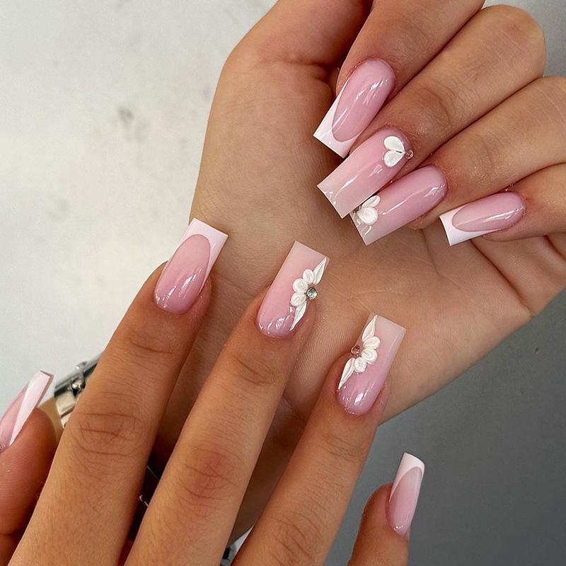 

Medium-Length French Edge Nude Rhinestone Fake Nail Tips with Floral Design