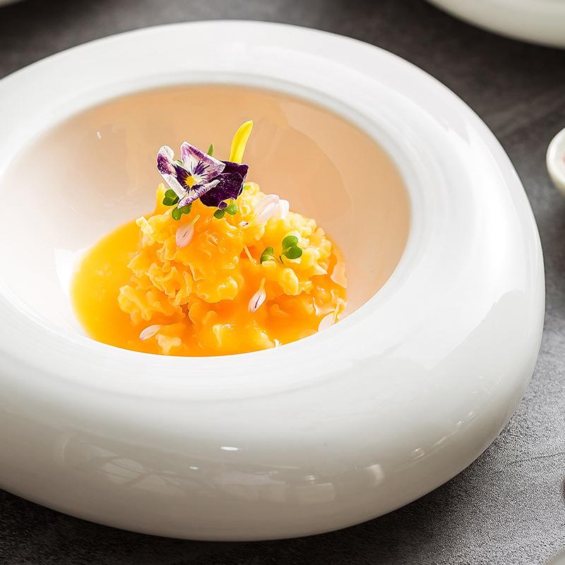 High-end hotel restaurant ceramic insulation plate white irregular position on the western food cold dish plate.