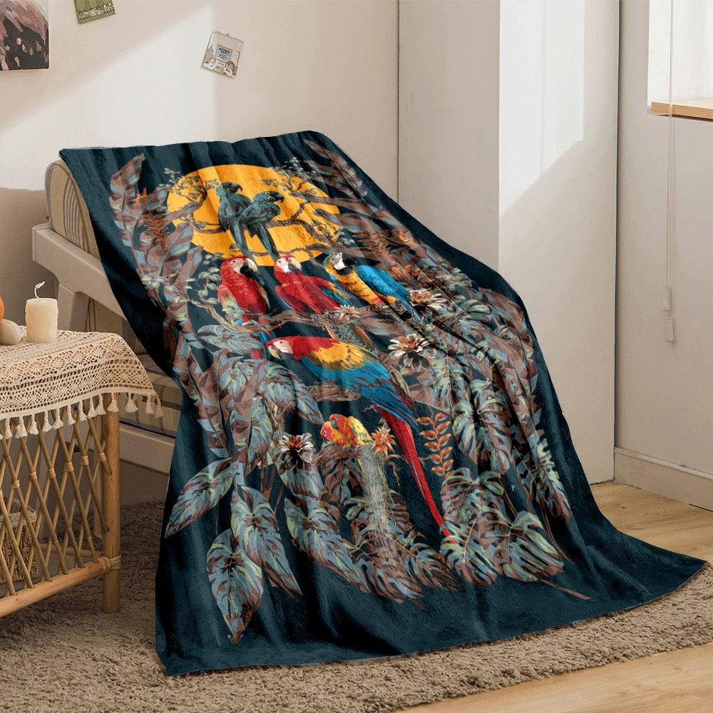 Colorful parrots perched on branches with tropical foliage and a sunset. for all seasons blanket lunch break throw gift