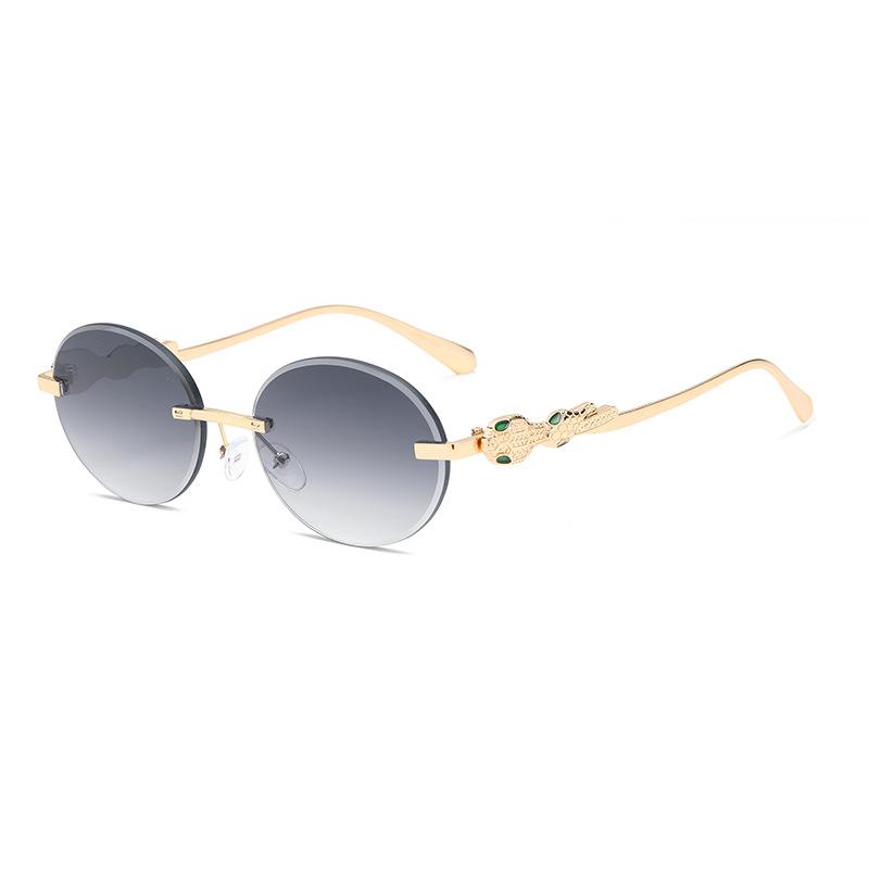 Europe and the United States gradual change frameless sunglasses oval frame fashion street shot anti-ultraviolet sunglasses retro trimmed sunshade gla