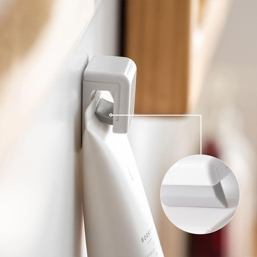 Traceless Plastic Clip for Toothpaste Self Adhesive Hanging Toothpaste Stand Dispenser for Bathroom Use