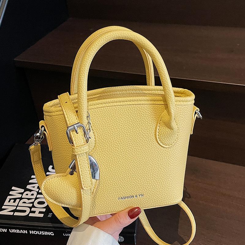 2025 New Fashion High Sense Temperament Simple Hand Carrying Bucket Bag Women's Niche Lychee Pattern Commuter Messenger Bag