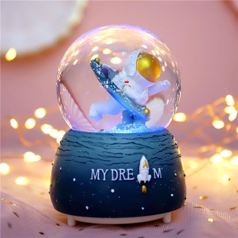 Adorno de Bola de Cristal Musical de Astronauta Nevado