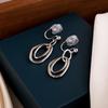 Niche Metal Circle Clip-On Earrings for Unpierced Ears - Fashionable, Mosquito Coil Design