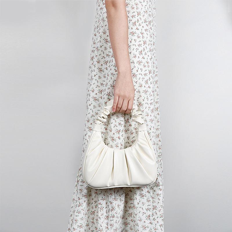 Niche design cloud bag  armpit bag  pleated handbag  fashionable and trendy hand-held cow horn high-end bag