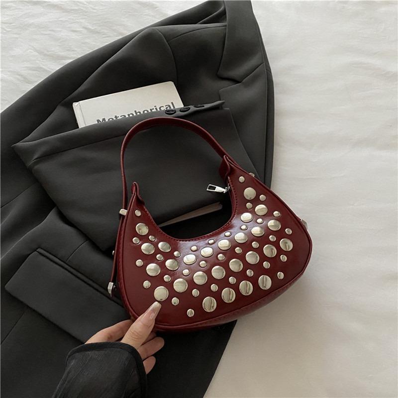 Einfache und modische neue Frühling-Achseltasche, Persönlichkeit, cool, mit Polka-Dot-Nieten, tragbare Knödel-Damentasche