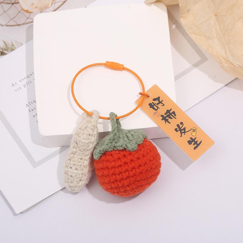 

Брелок-подвеска в виде сумки с красной хурмой - идеальный сувенирный подарок для студентов и подруг