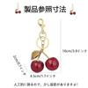 RuiMi Cherry-shaped keychain convenient bag strap cute accessory.