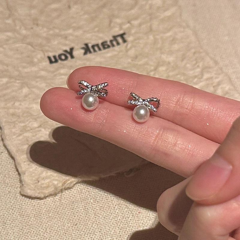 Elegant Zircon Pearl Bow Stud Earrings for Women: Luxurious, Unique, Minimalist, and Versatile.