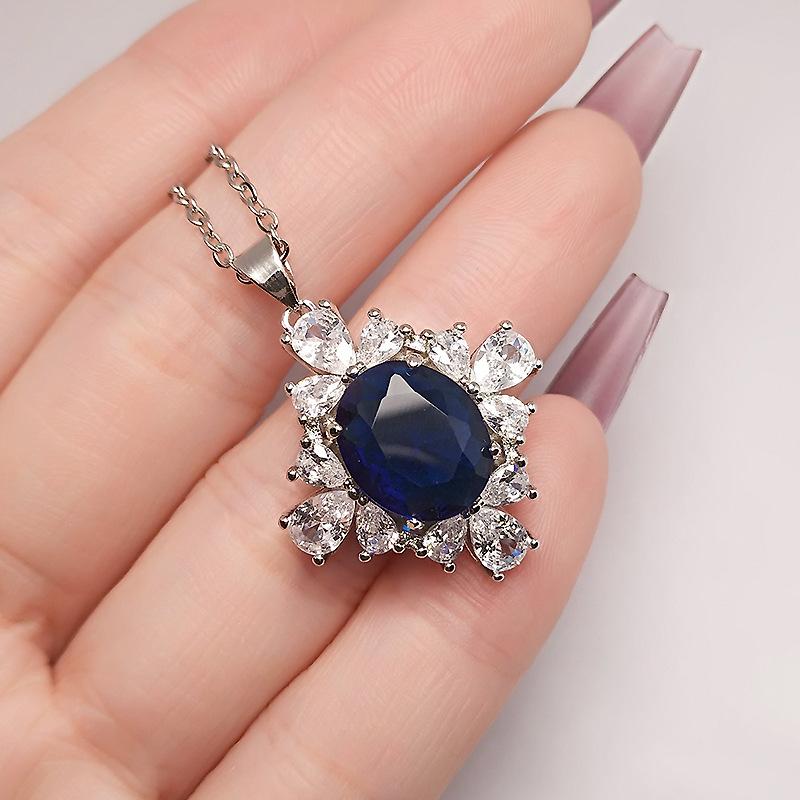 

Полный бриллиантов Высокосияющий сапфировый кулон Роскошный высококлассный четырехсторонний цветок Красный камень Цветной драгоценный камень Ожерелье