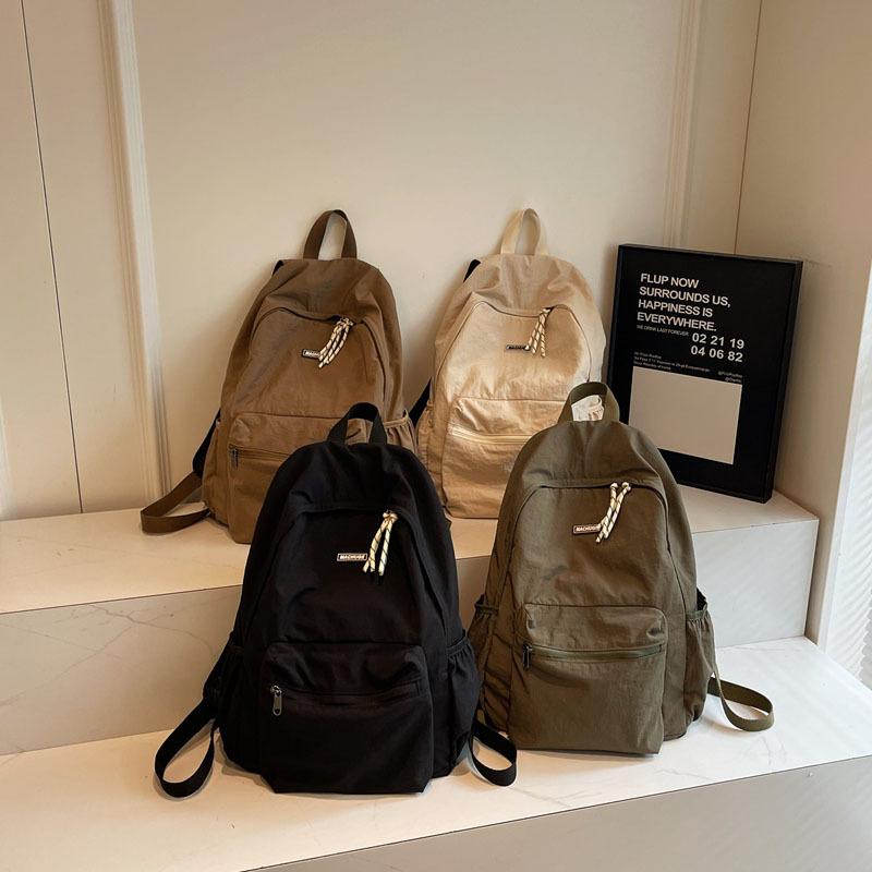 Simple and fashionable large-capacity backpack 2025 new leisure niche college class schoolbag women's solid color backpack