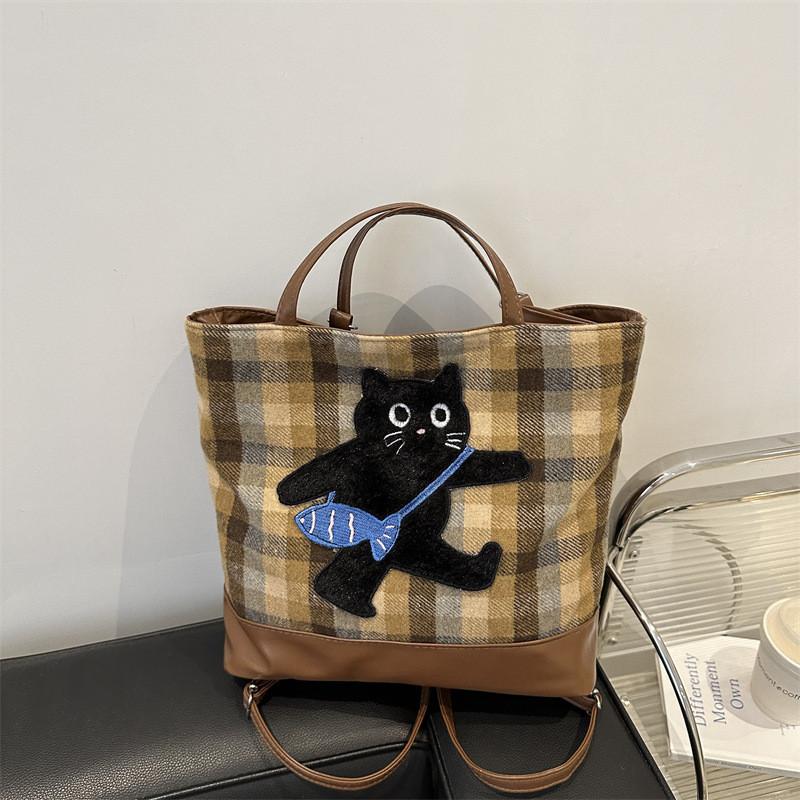 Stilvolle, geräumige Schultertasche mit Cartoon-Motiv aus der Winterkollektion in Blau und Braun