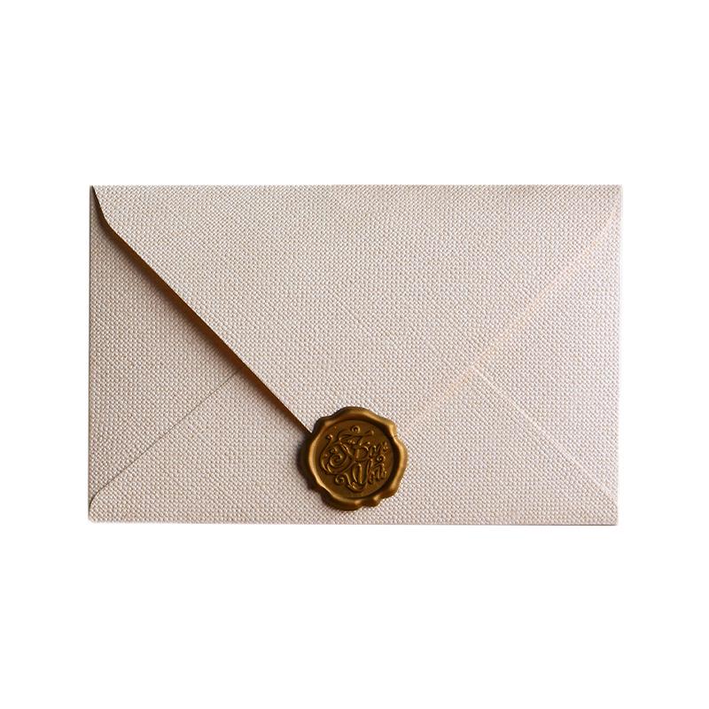 Retro Chinese Linen Pattern Letter Set with Kraft Paper, Sealing Wax, and Envelopes.