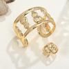 Lässiger Urlaubsstil Hohl-Seestern-Muschel Armband Ring Set Offenes Metallarmband Armband Schmuck