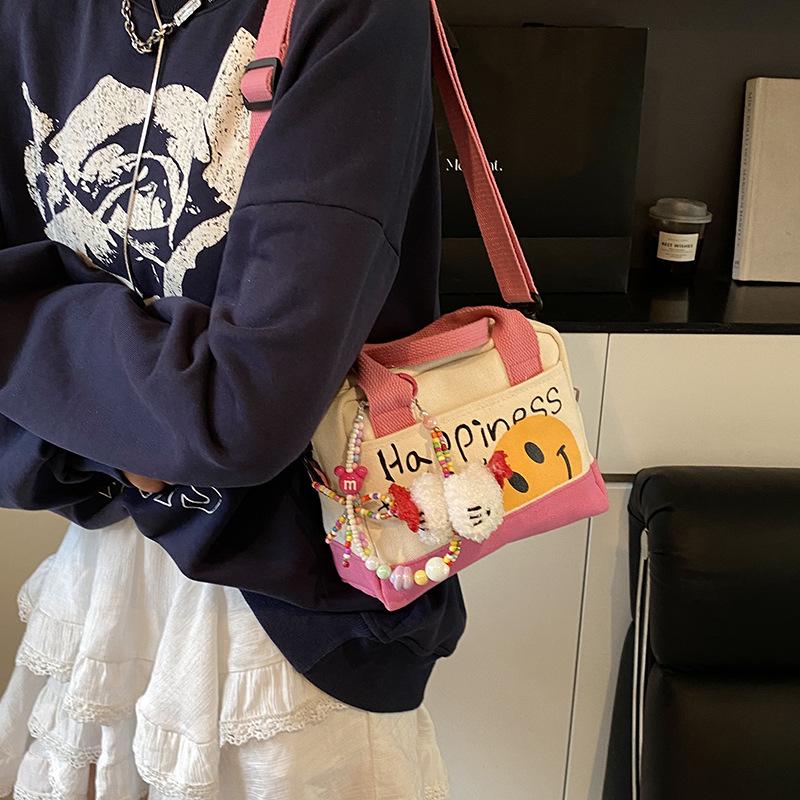 Cute spring girl handbag hand carry out niche small square bag Korean version fashion trend shoulder messenger bag