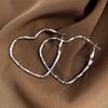 Trendy Twisted Heart Women's Hoop Earrings Silver Color Metal Hollow Love Heart Loop Earrings for Female Irregular Ear JewelryGood Product