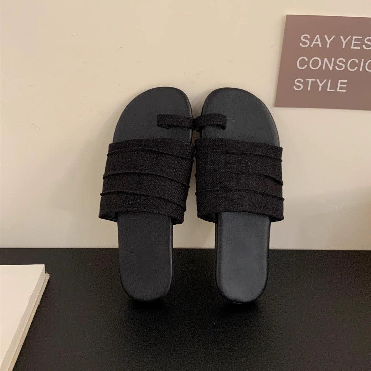 

Holiday wind cover toe flat slippers women s outer wear summer 2025 new casual one-word drag temperament beach women s shoes 39