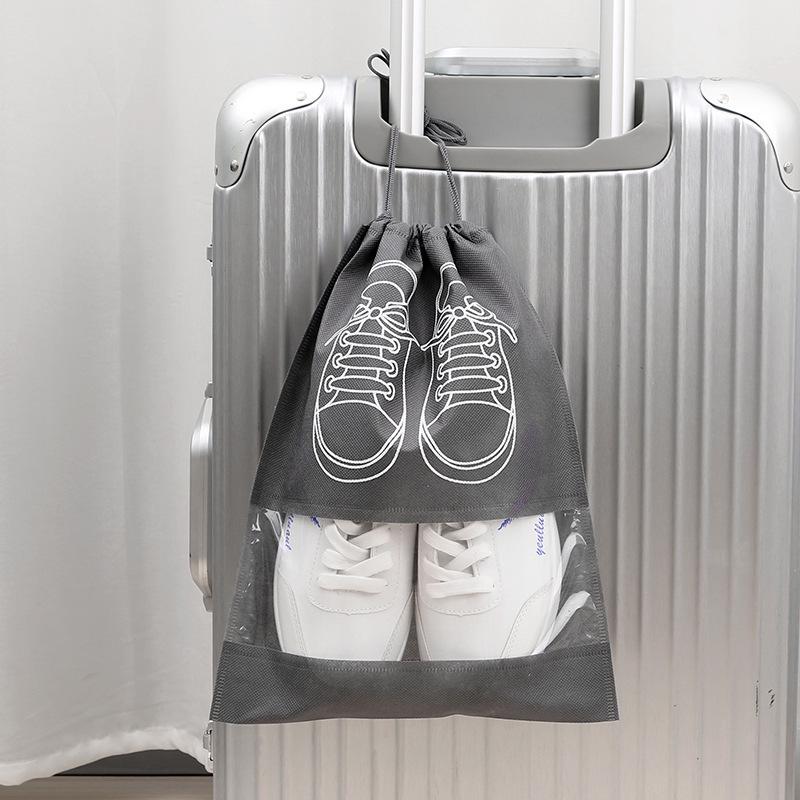Dustproof & Moisture-proof Non-Woven Shoe Storage Bag with Drawstring for Travel Organization.