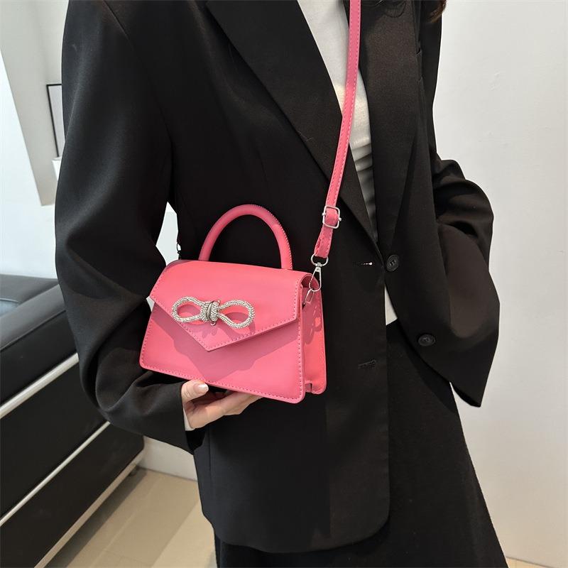 Simple and popular versatile solid color bow sewing line women's bag fashionable oblique span shoulder handbag