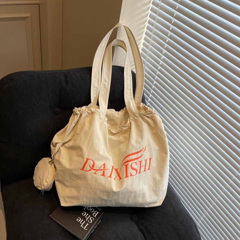 

Niche canvas bag women s 2025 new summer shoulder bag large capacity student underarm tote bag хакі