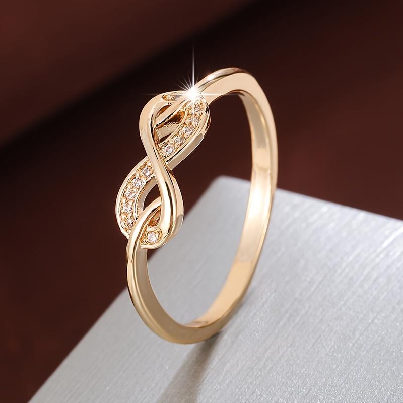 Bague tendance conçue dans un style en forme de 8 avec incrustation de zircones. Convient aux femmes