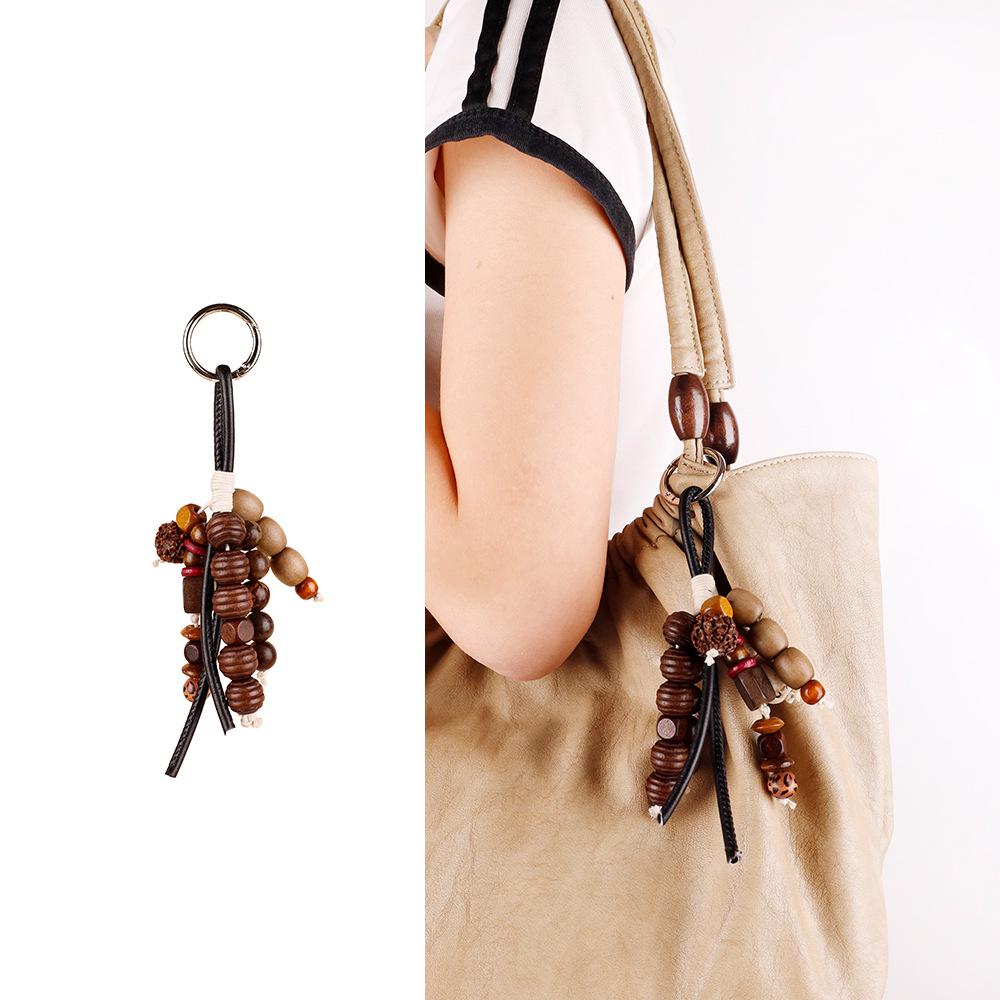 

Natural Sound Healing Keychain: Wish Seed String & Coconut Shell Pendant with Wood Beads - Handmade Chinese Accessory Individually Packaged