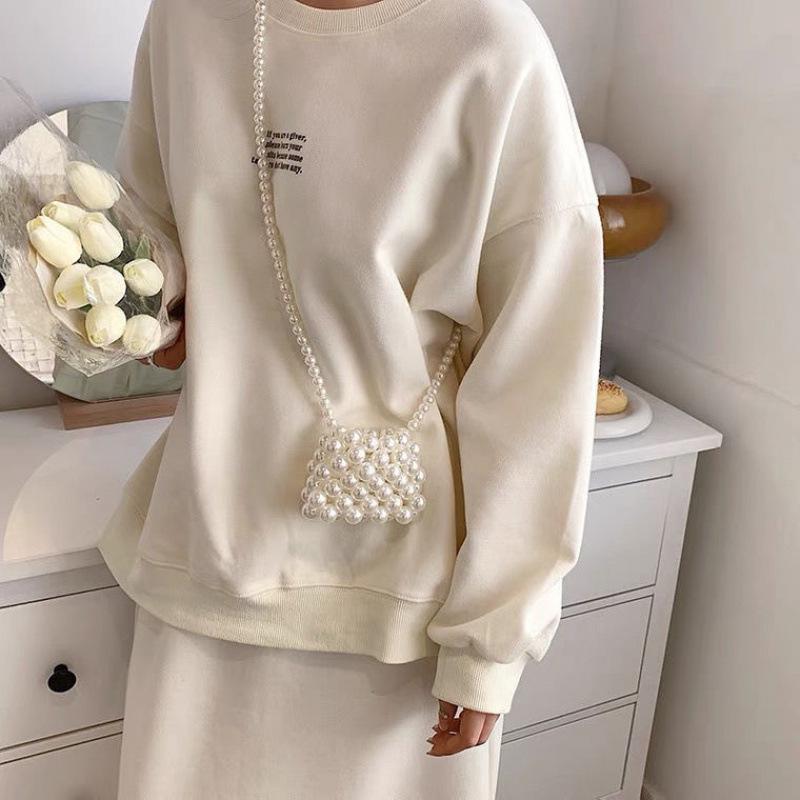 

2025 Summer Pearl Hand-Woven Crossbody Bag: Fashionable Hollow Out Niche Design