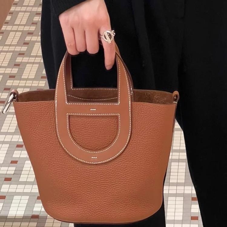 2025 neue Schweinenase Gemüsekorb Eimerbeutel Mode tragbare Damenhandtasche Lychee-Muster erste Schicht Rindsleder lässiges Leder