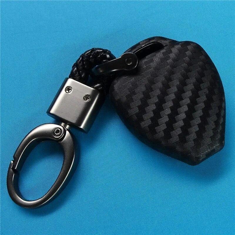 Husa pentru chei de masina din silicon din fibra de carbon pentru Toyota Auris HiLux Corolla Fortuner Prado Verso Camry Yaris Vitz Vios Ractis