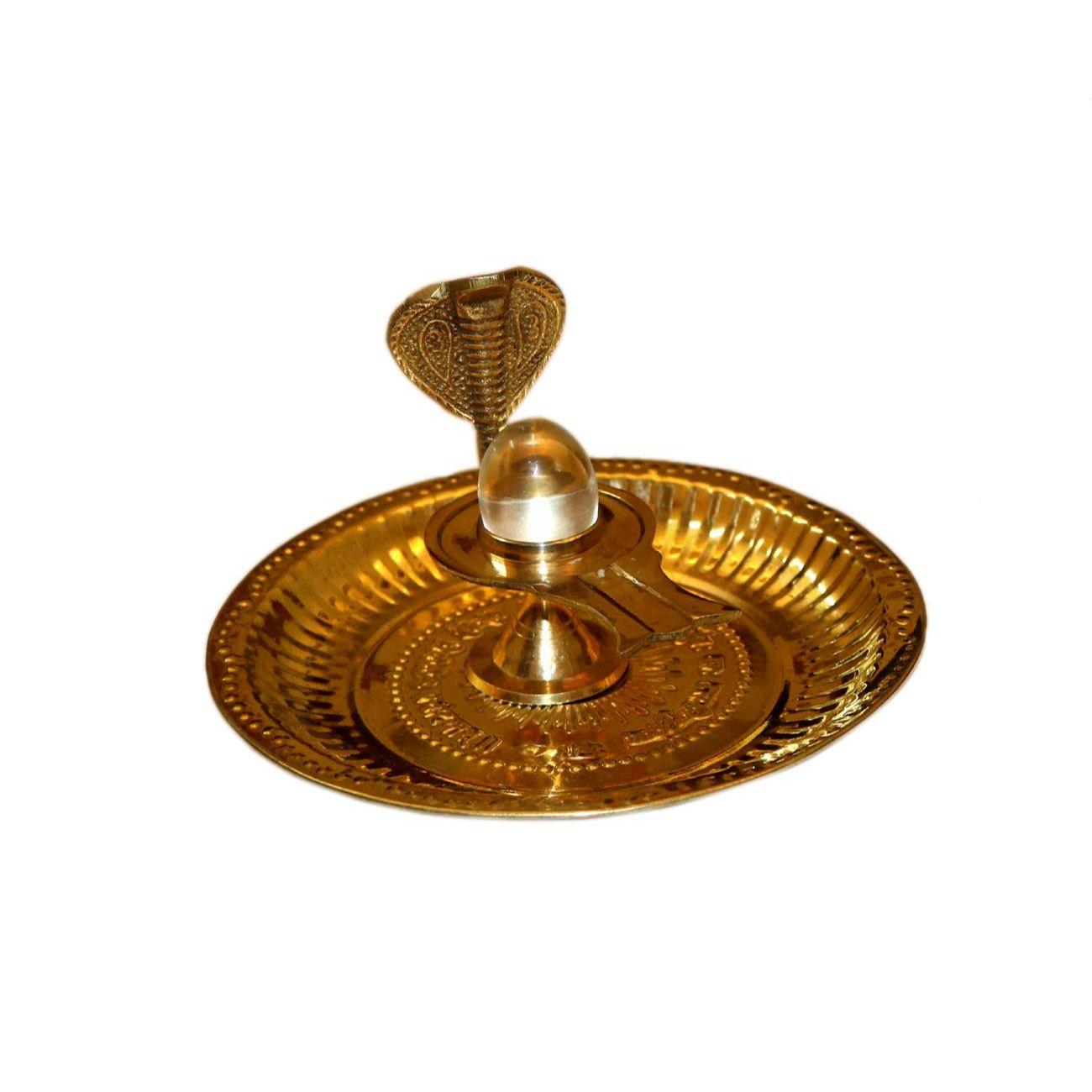 

Crystal Sphatik Shivling with Brass Jalahari Yoni Plate Brass Pieces